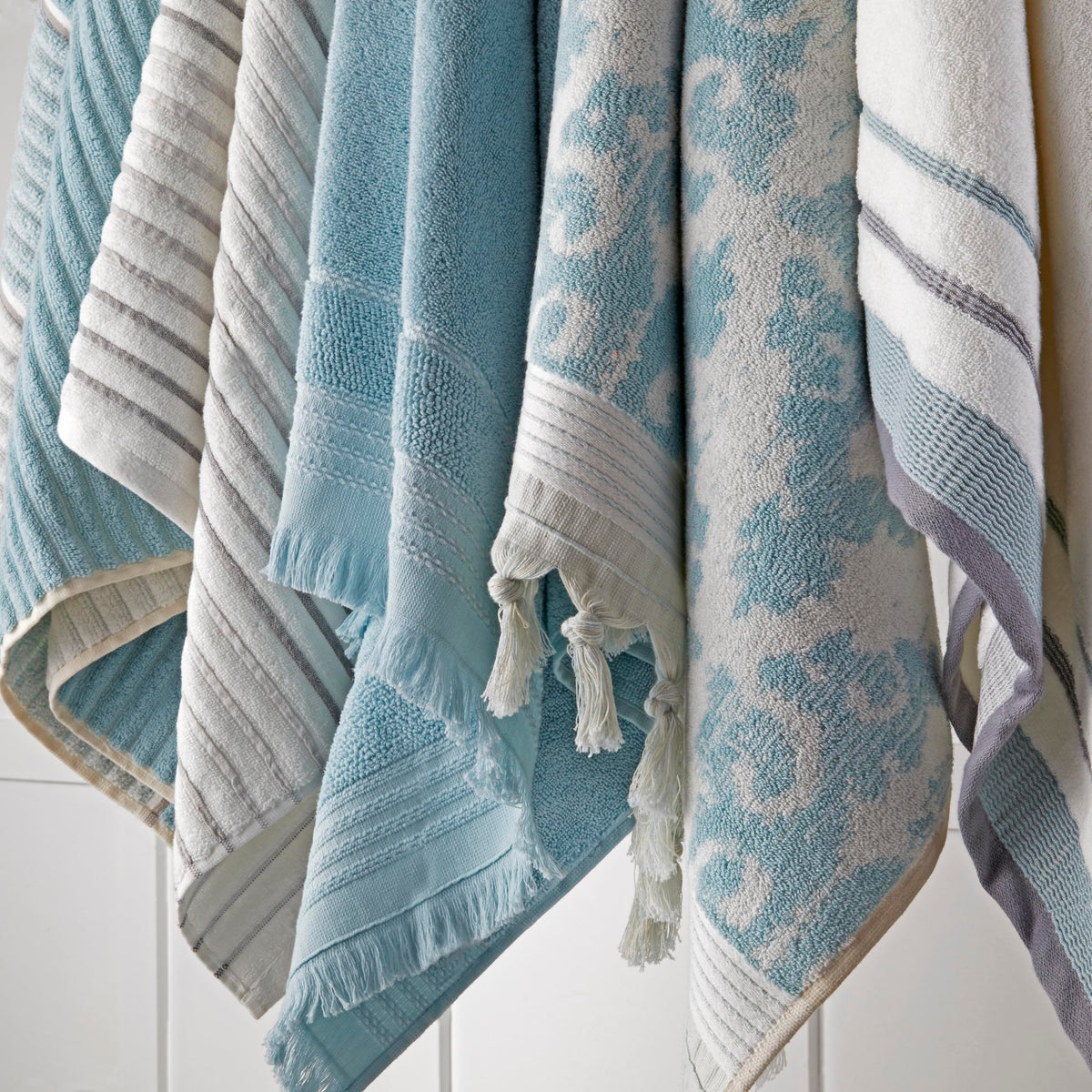 Air-dried Mirage Fringe towel in aqua highlighting lightweight absorbency