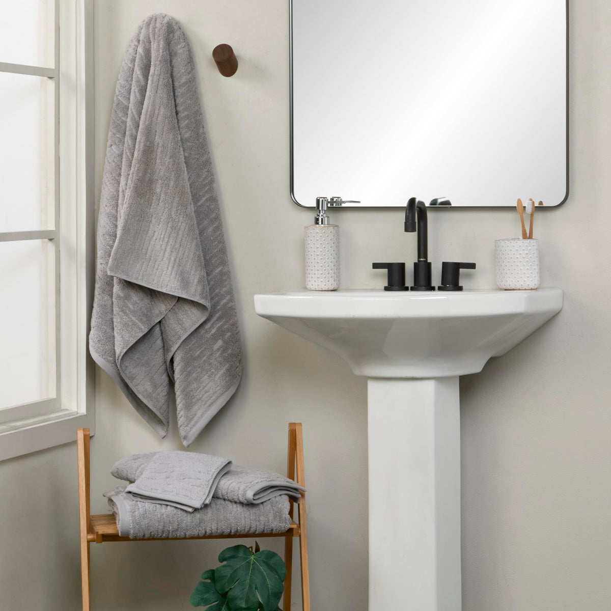 SKL Home CloudSoft two-pack gray hand towels on bathroom display