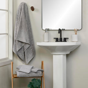 SKL Home CloudSoft two-pack gray hand towels on bathroom display