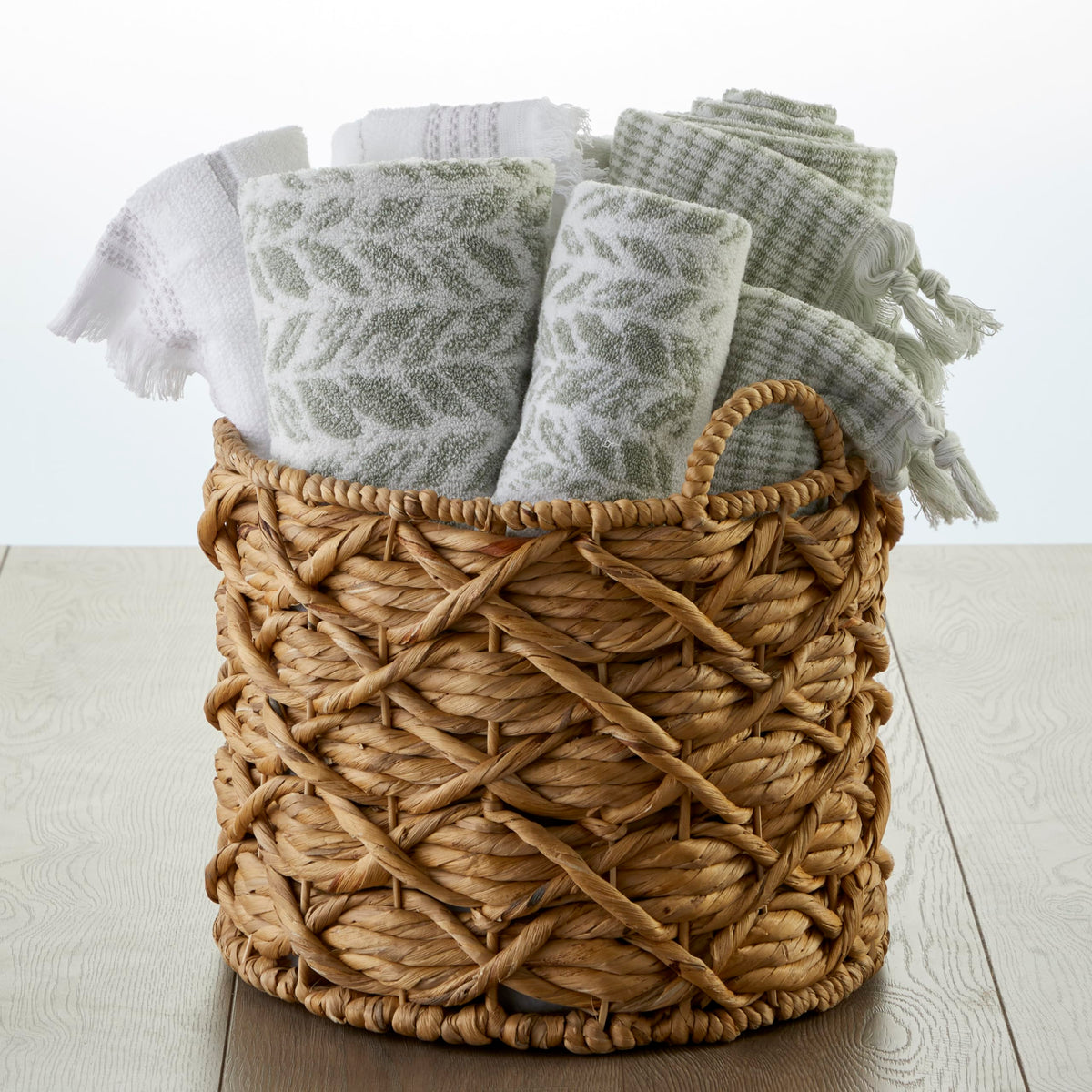 SKL Home Distressed Leaves hand towel shows two-tone jacquard weave for subtle elegance