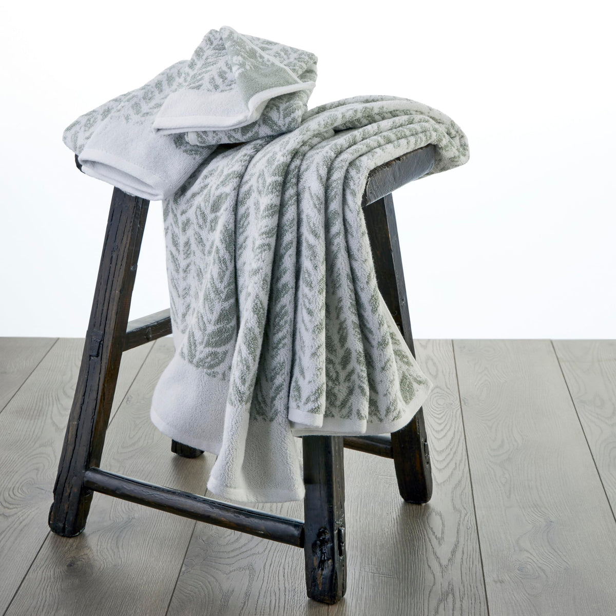 SKL Home Distressed Leaves hand towel features durable double-stitched edges for daily use