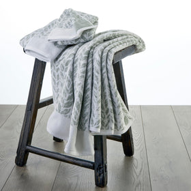 SKL Home Distressed Leaves hand towel features durable double-stitched edges for daily use