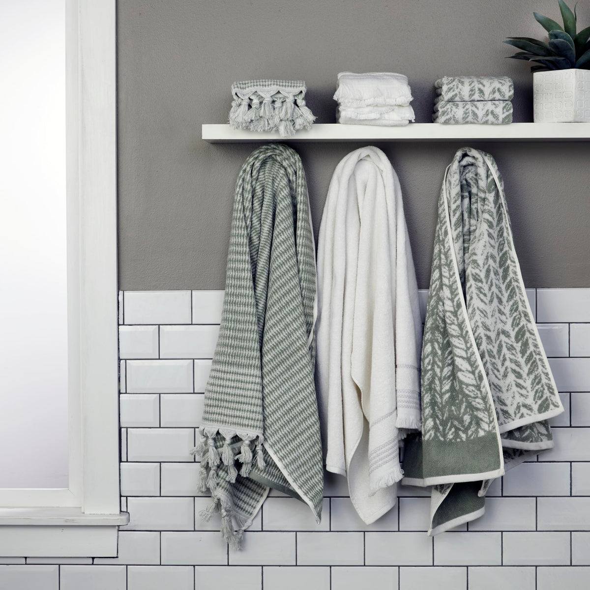 SKL Home Distressed Leaves hand towel pairs with coordinating bath towels