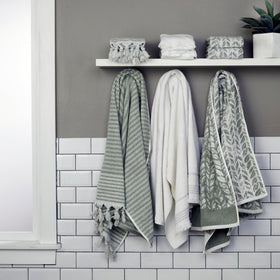 SKL Home Distressed Leaves hand towel pairs with coordinating bath towels