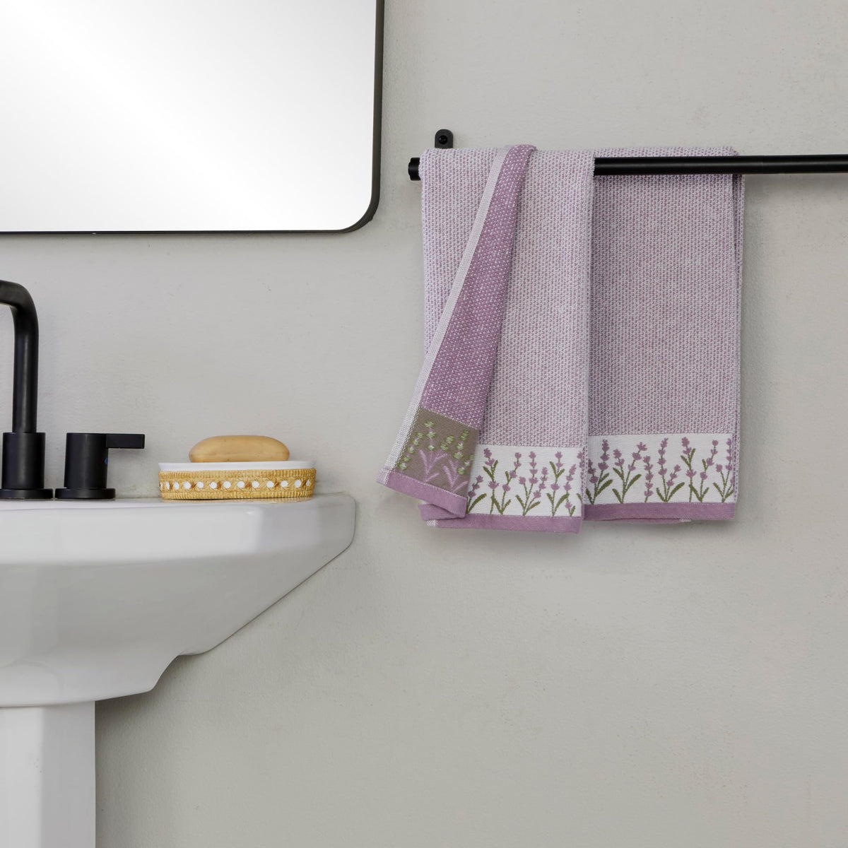 Towels displayed in bath and kitchen sinks for versatile spaces