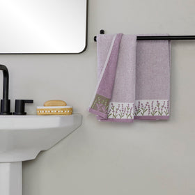 Towels displayed in bath and kitchen sinks for versatile spaces