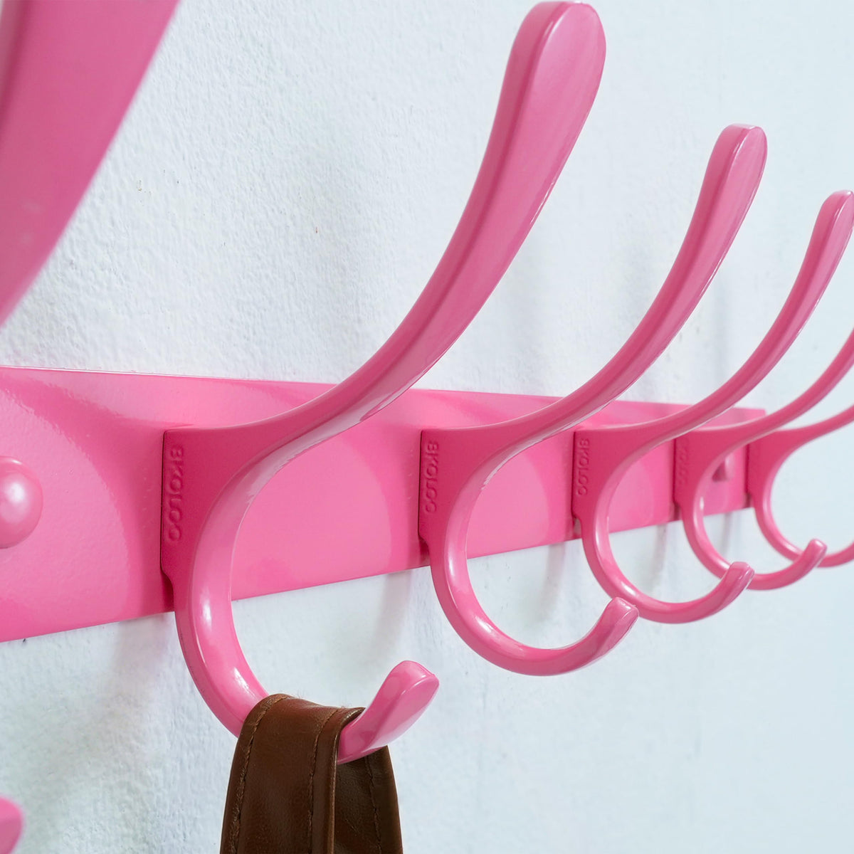 SKOLOO coat rack in an entryway with hardware included for easy installation.