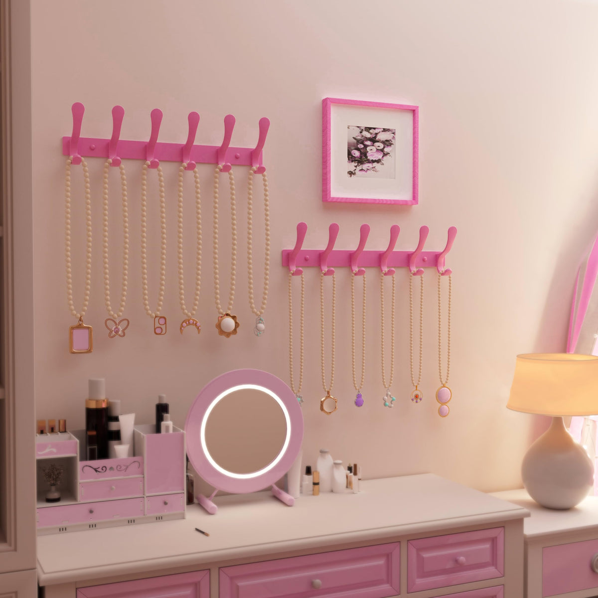 SKOLOO pink wall hook rail demonstrates space-saving, multipurpose storage for coats and bags.