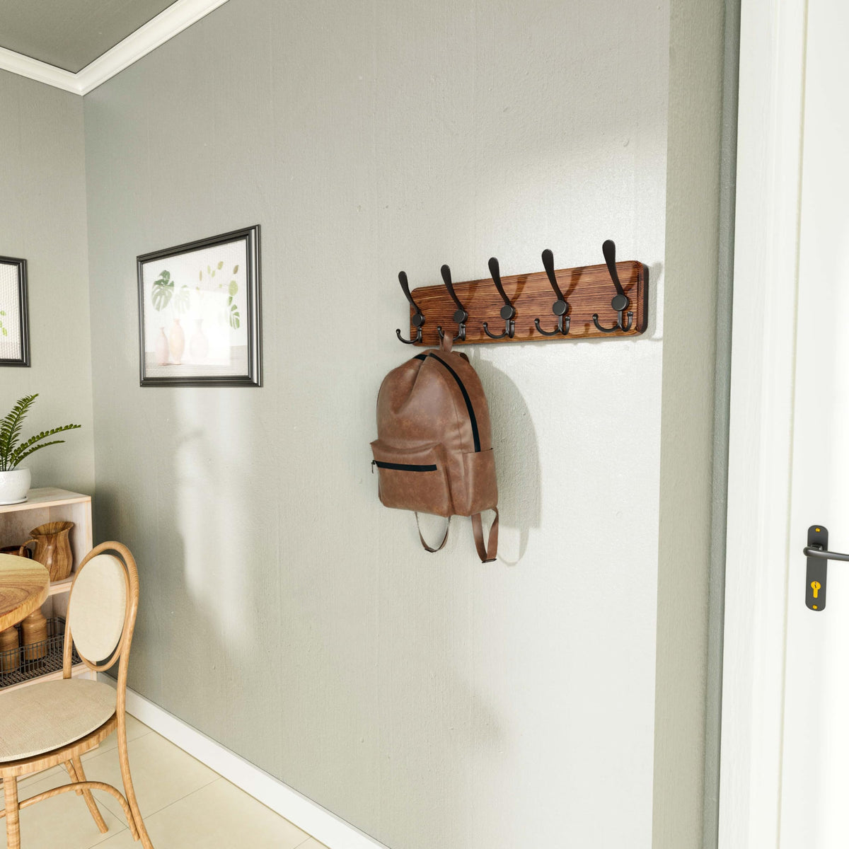 SKOLOO coat rack with five triple hooks for versatile hanging options.