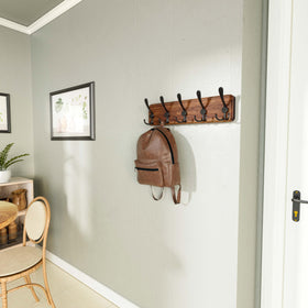 SKOLOO coat rack with five triple hooks for versatile hanging options.