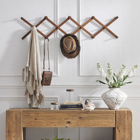 SKOLOO walnut wall mount extended to demonstrate 57-inch reach.