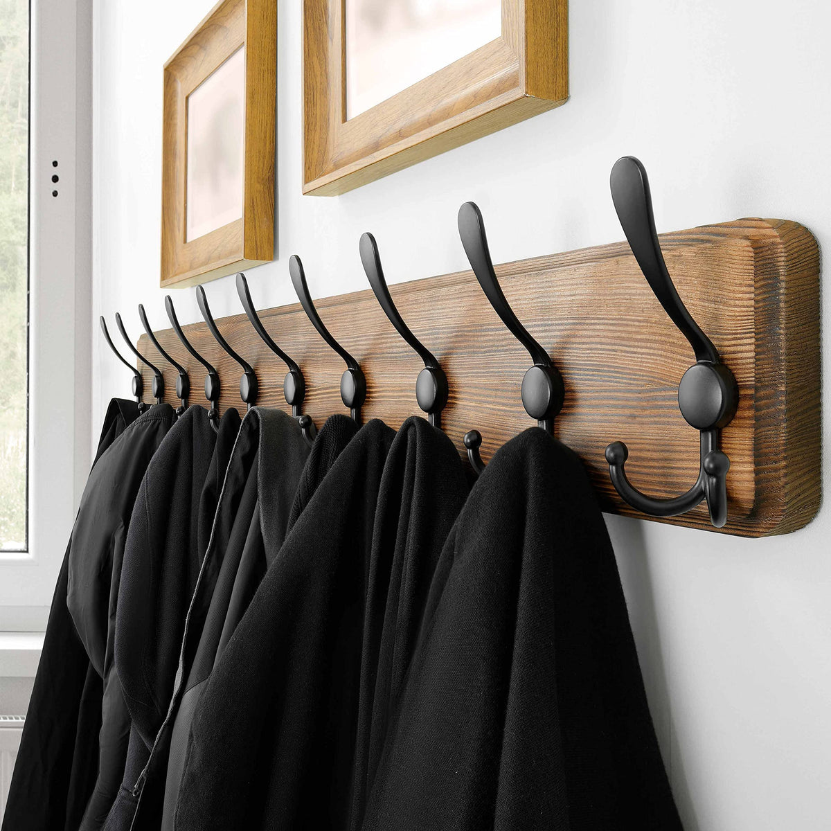 SKOLOO wooden coat rack with 10 triple hooks for versatile storage.