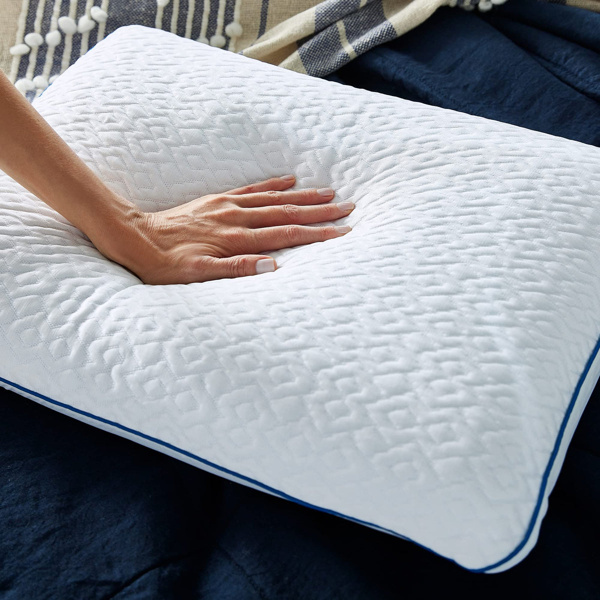 Sleep Innovations Forever Cool pillow in bed supporting back, side, and stomach sleepers.