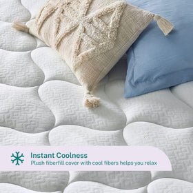 Queen-size topper on a bed showing generous coverage and fit