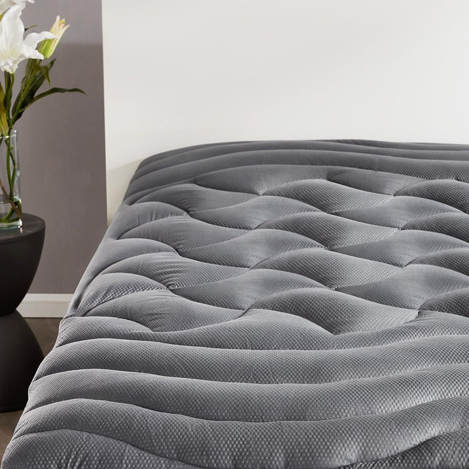 Sleep Zone cooling queen topper cover shows breathable surface for cooler nights.