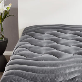 SLEEP ZONE full-size cooling topper on a double bed for enhanced comfort.