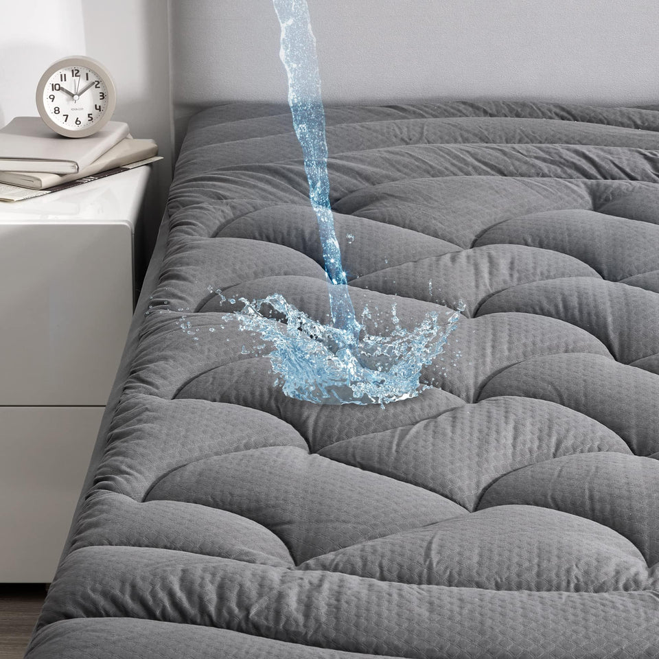 SLEEP ZONE grey waterproof mattress pad with full-topper protects against spills.