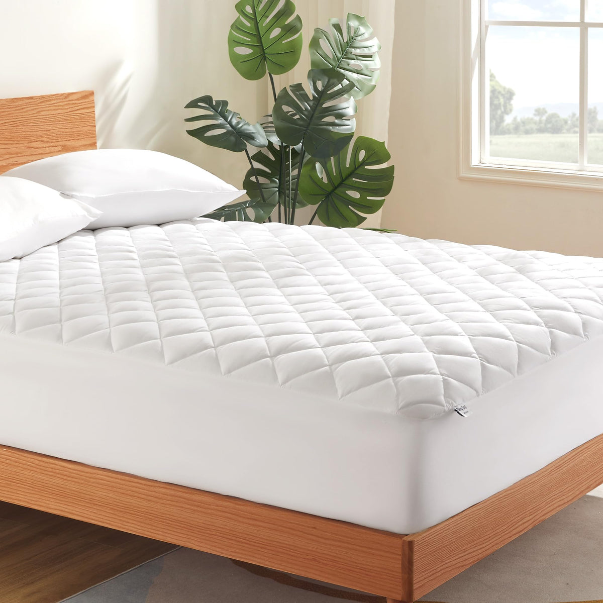 Sleep Zone queen mattress cover on bed with quilted breathable top for cooling comfort.