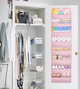 SLEEPING LAMB pink baby room decor adds cute, organized storage for kids.