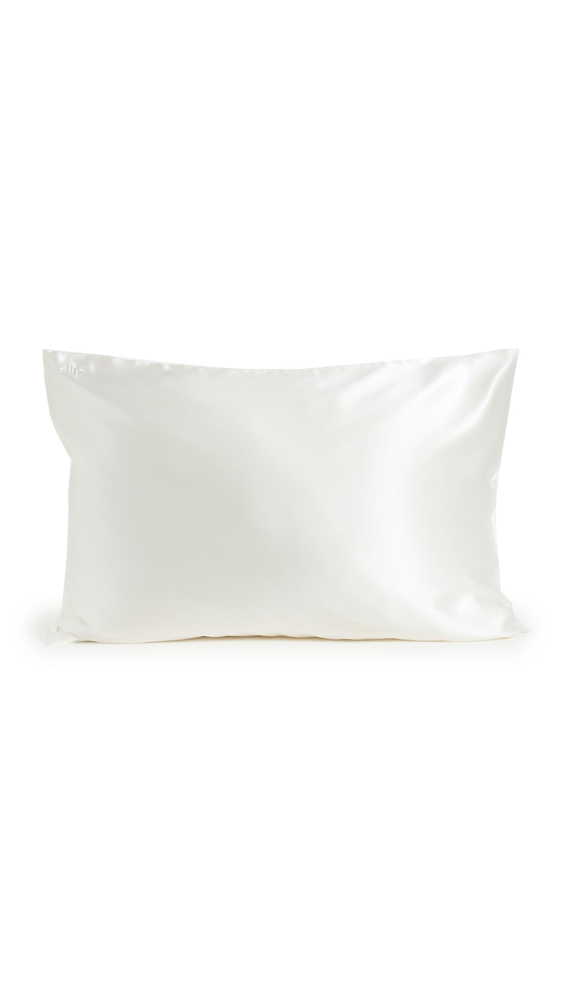 SLIP silk pillowcase on bed setting conveys premium sleep luxury and comfort