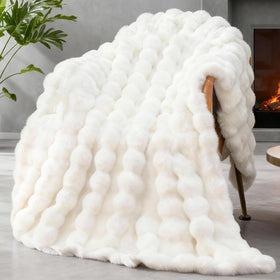 SLIVERY&CHAVALIER faux fur throw exterior delivers plush warmth on the sofa
