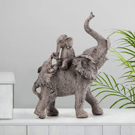 Smadeer antique brown finish on the elephant statue enhances rustic spaces.