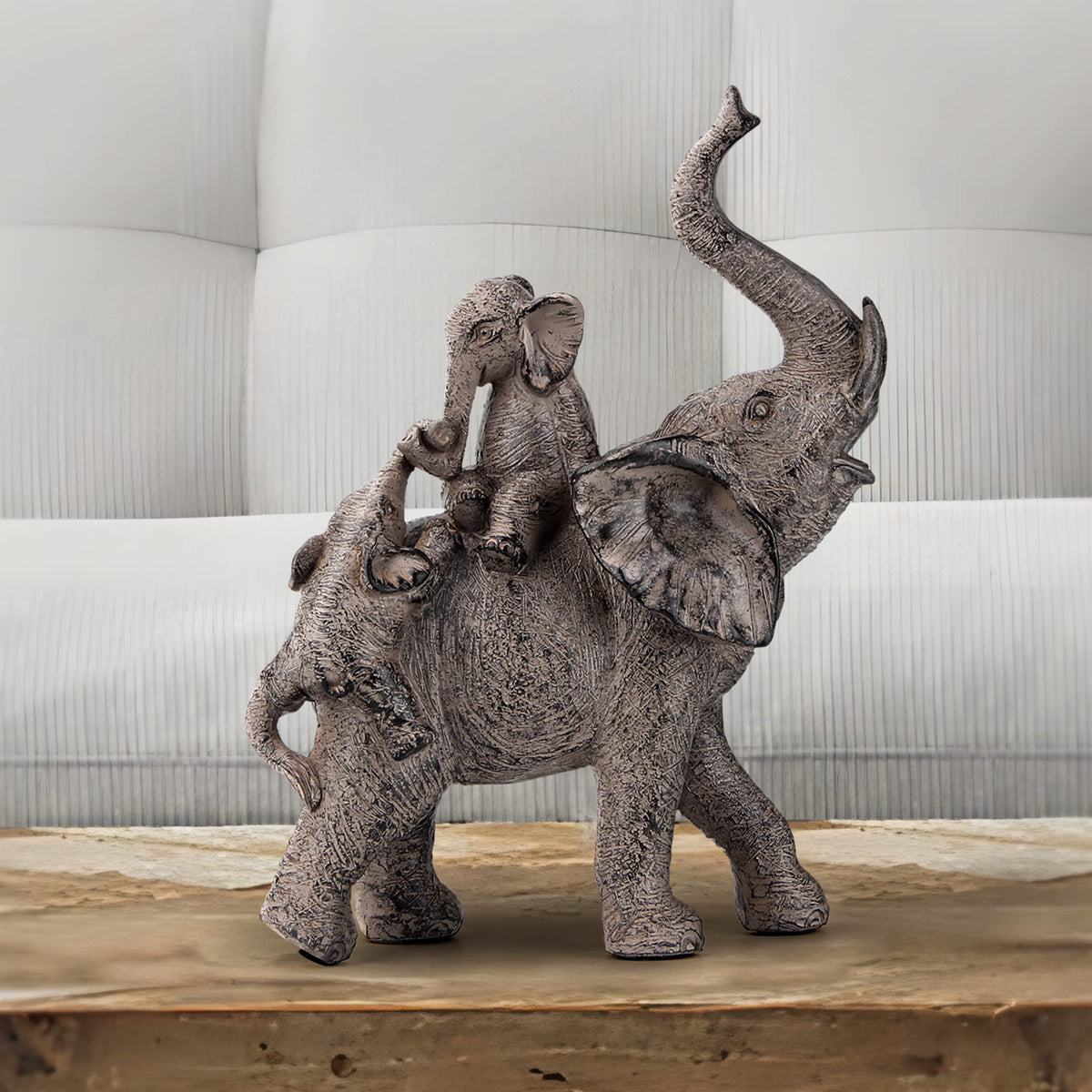 Smadeer elephant statue displayed on a tabletop, sparks conversation about family.