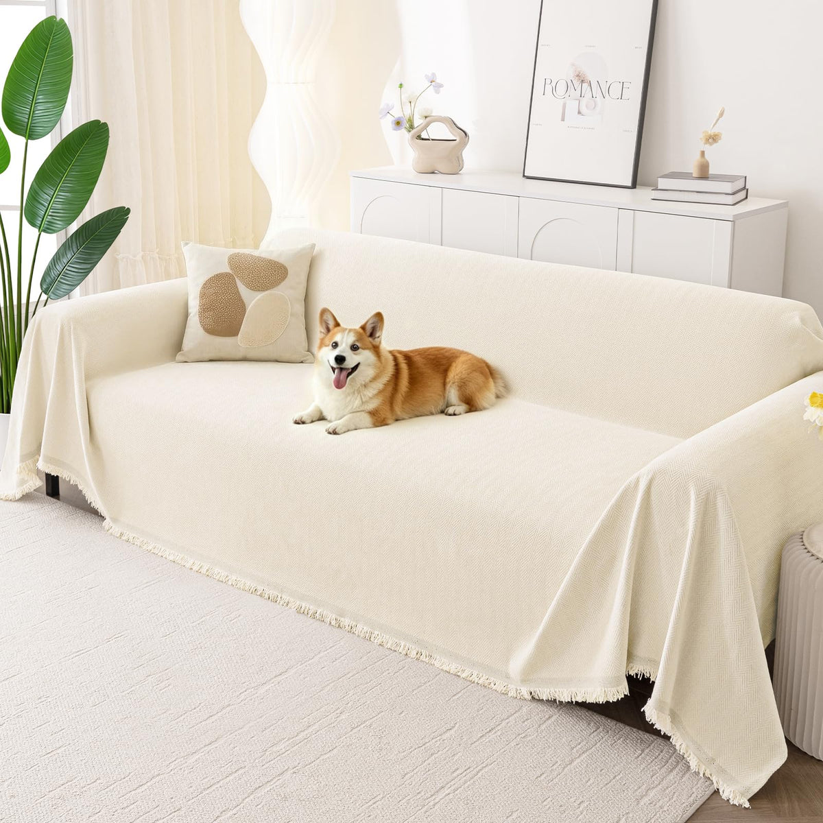 Smiry couch cover on beige sofa offering soft protection against pet hair.
