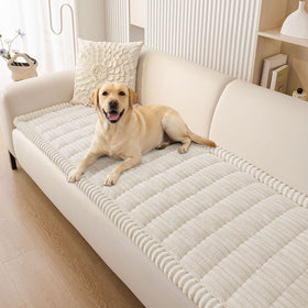 Smiry couch cover on a sofa showing cozy fuzz and protection.