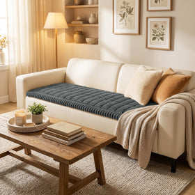 Smiry couch cover demonstrates non-slip silicone grip to prevent shifting on furniture.