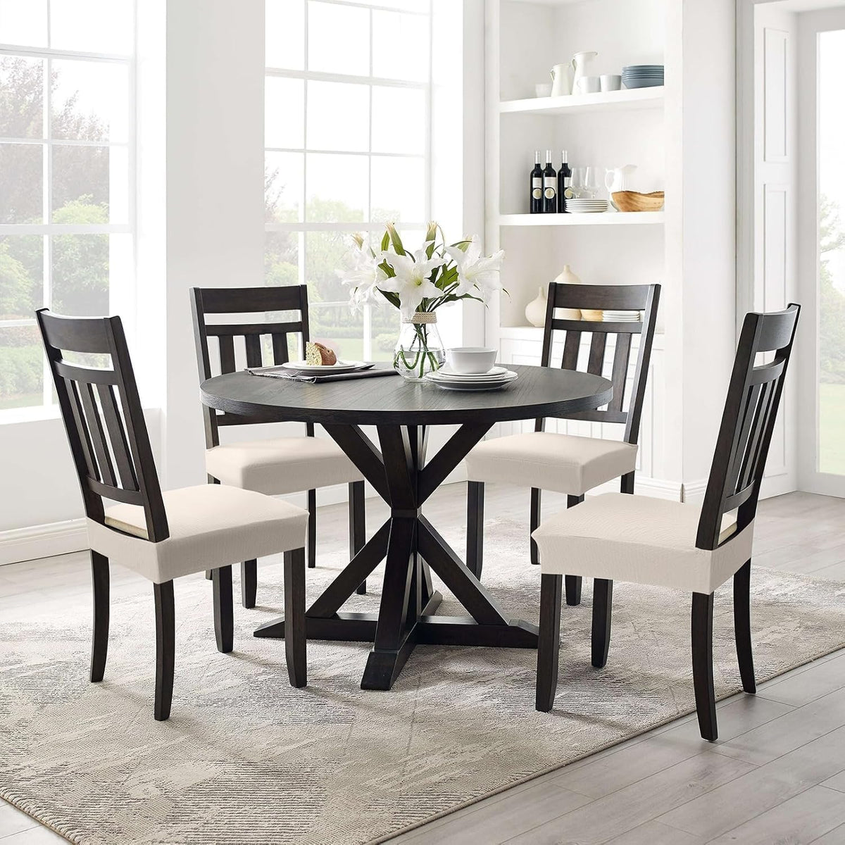 Smiry dining room setup with beige chair covers creates a refreshed look.