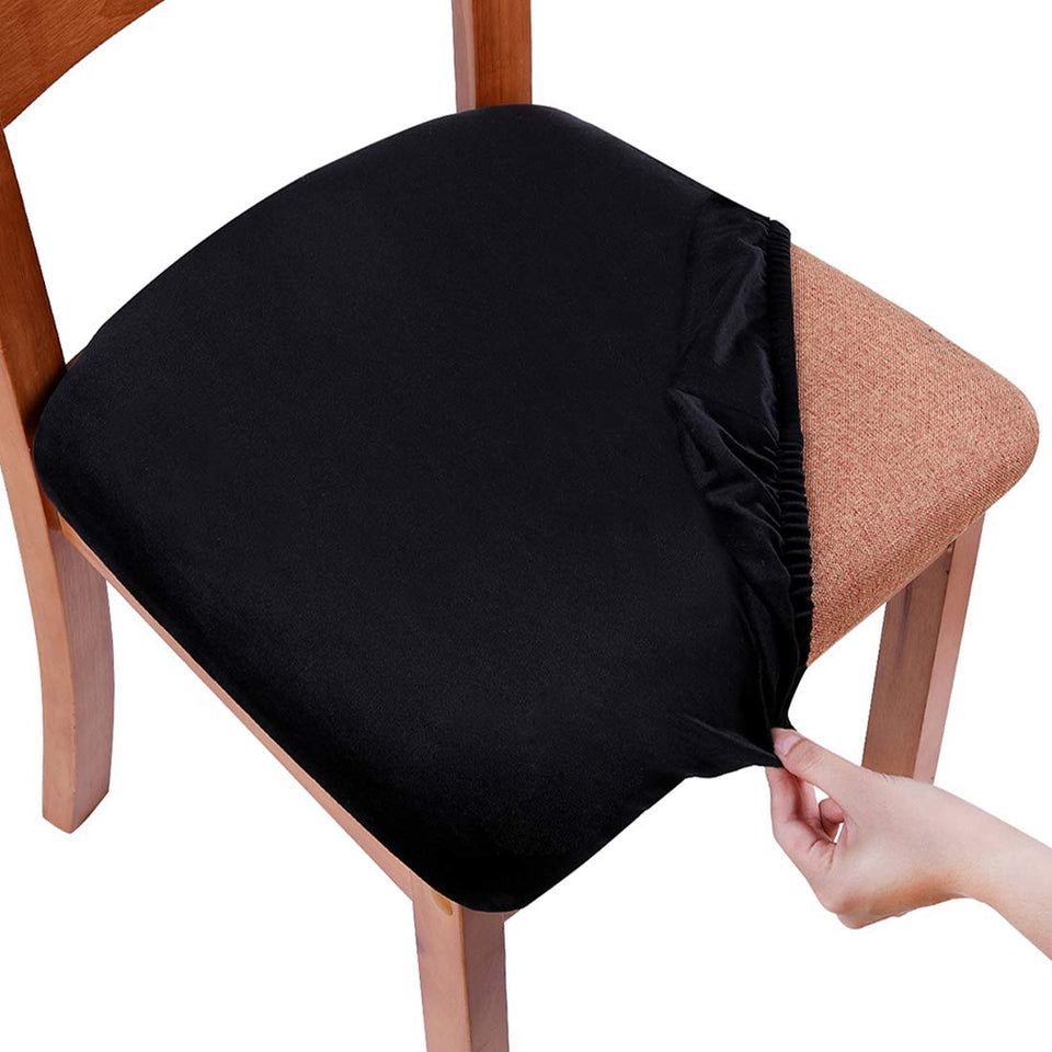Smiry velvet seat cover on dining chairs adds style and protection.