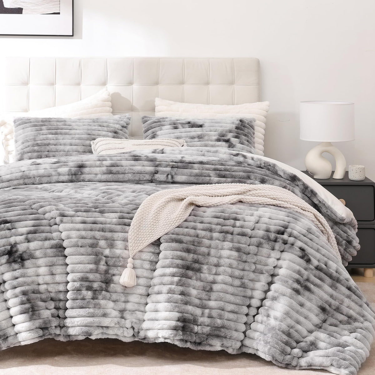 Smoofy fluffy king-size comforter set on bed with tie-dye grey fleece for warmth