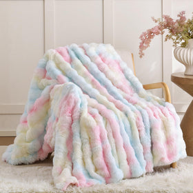 Smoofy rainbow bubble texture blanket on sofa, vibrant and cozy.