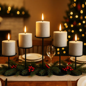 Smtyle pillar candle holders by the fireplace, warm ambiance.
