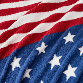 Snuggle Sac American Star Patriotic Throw folded on bed illustrating versatile decor and warmth