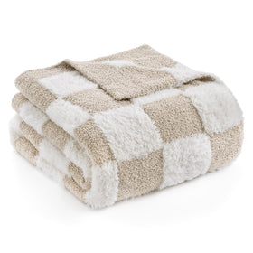 Snuggle Sac beige checkered throw on bed enhances cozy bedroom texture.