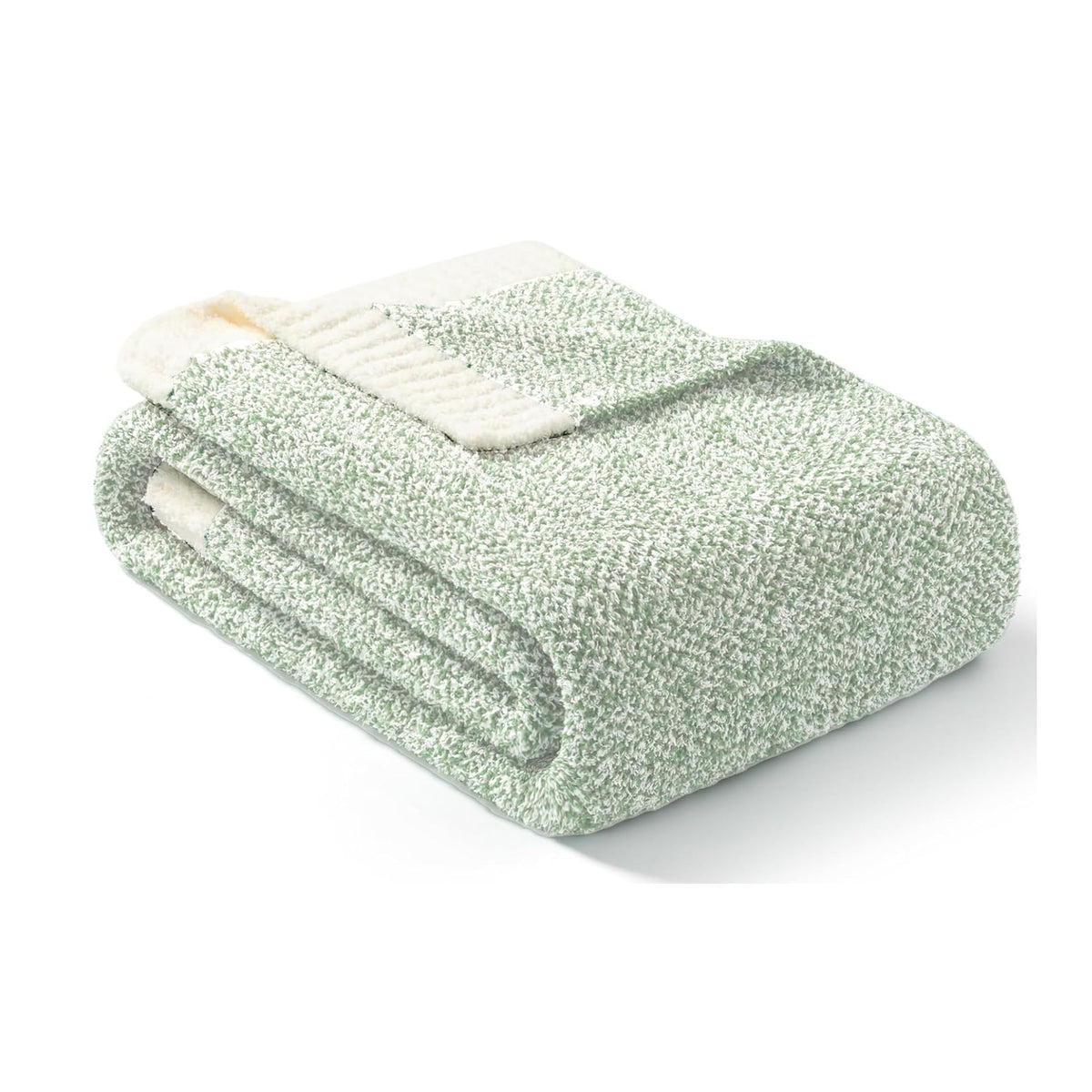 Sage green throw draped on bed adds warmth and texture to the room