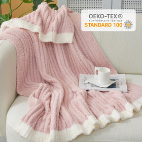 Ivory edge trim adds subtle contrast to the blanket’s look.