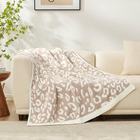 Snuggle Sac leopard blanket folded ready for versatile living space styling.