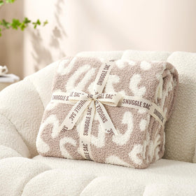 Snuggle Sac leopard blanket gift-pack ready for gifting.
