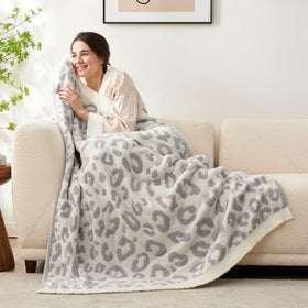 Snuggle Sac leopard throw on the bed adds extra comfort.