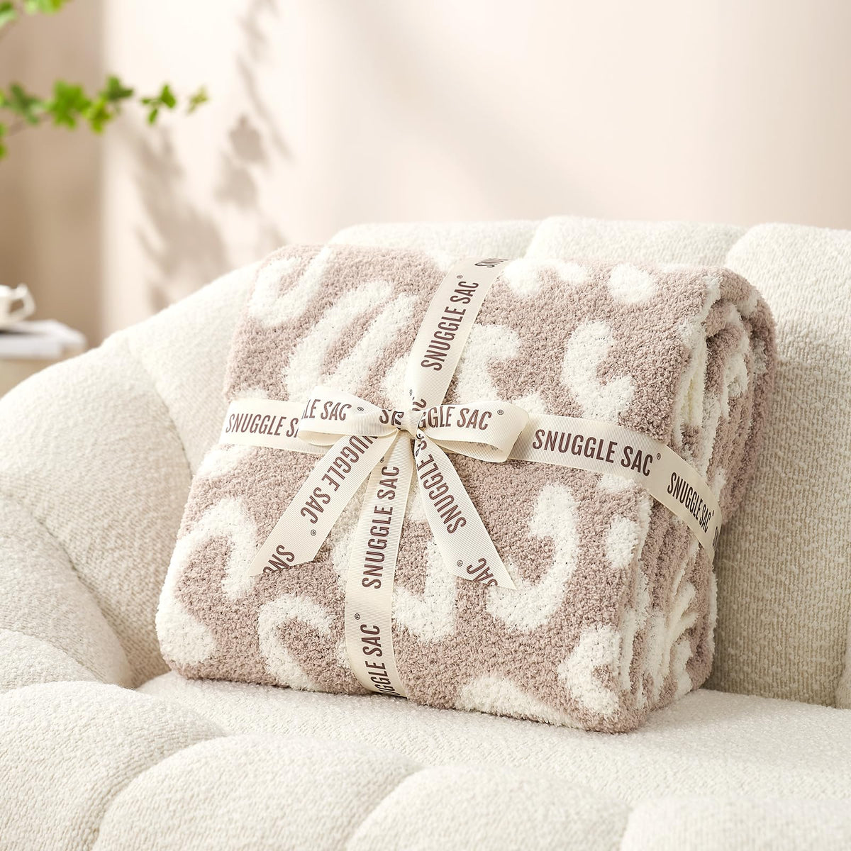 Snuggle Sac leopard throw outdoors for picnics or cozy cabin vibes