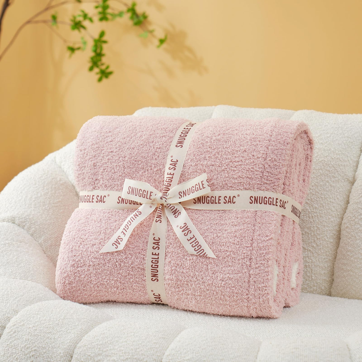 Snuggle Sac reversible design highlights two pink sides for versatile styling