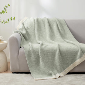Reversible heather color design on Snuggle Sac throw enhances decor.