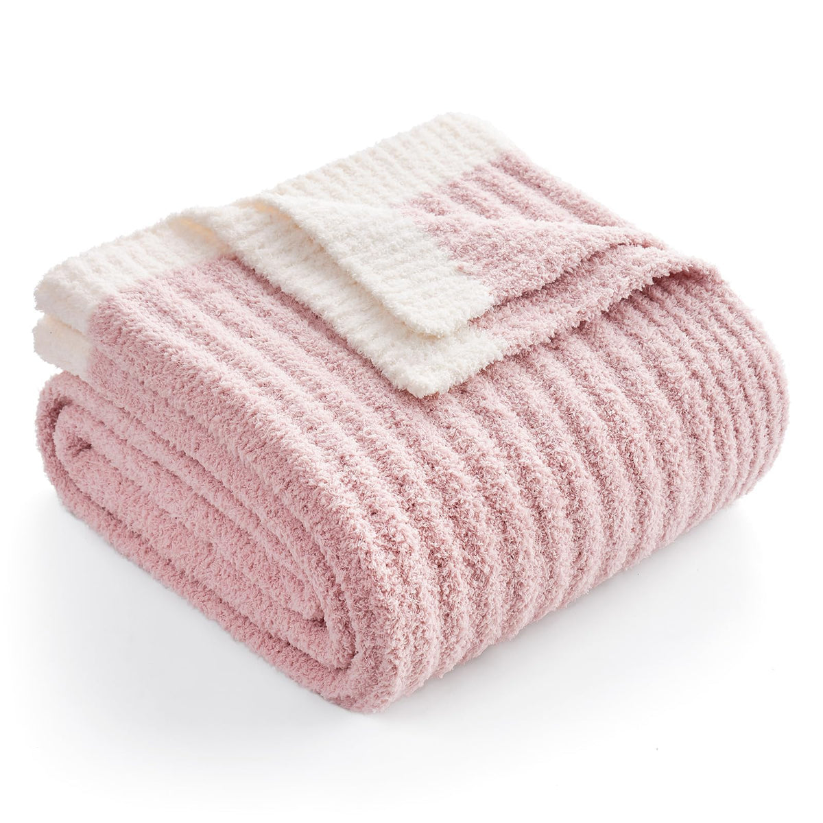 Snuggle Sac spring pink throw blanket on sofa provides cozy warmth for evenings.