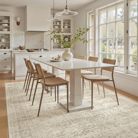 Soalmost 5x8 beige area rug folded edge, showing portability.