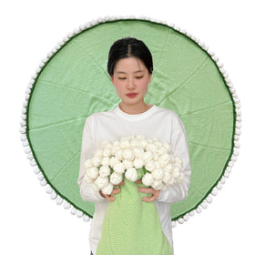 SoffMoiis bouquet-transformable blanket becomes a decorative bouquet when rolled.