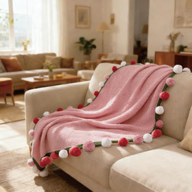SoffMoiis handcrafted floral throw showing artisanal craftsmanship