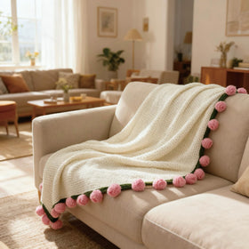 SoffMoiis pink rose blanket shown on bed as versatile home accent